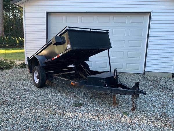 Dump Trailer Services dump trailer parked in a driveway