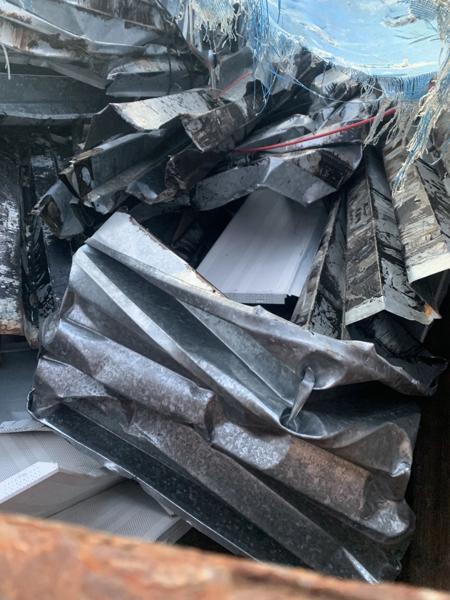 Load of scrap metal sheeting being hauled away